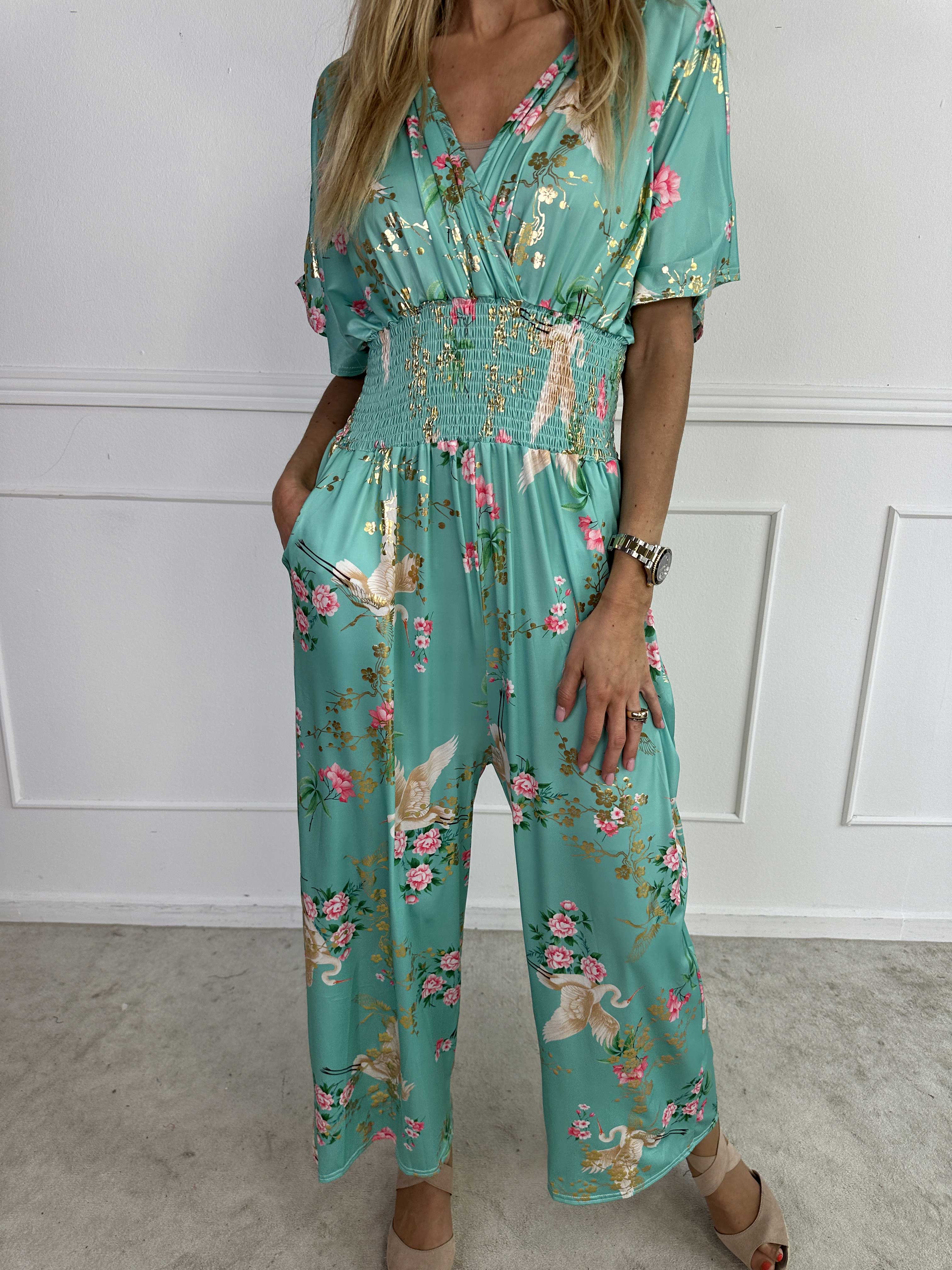 Pams Fly Jumpsuit - Elastisk buksedragt med blomster- og fugleprint